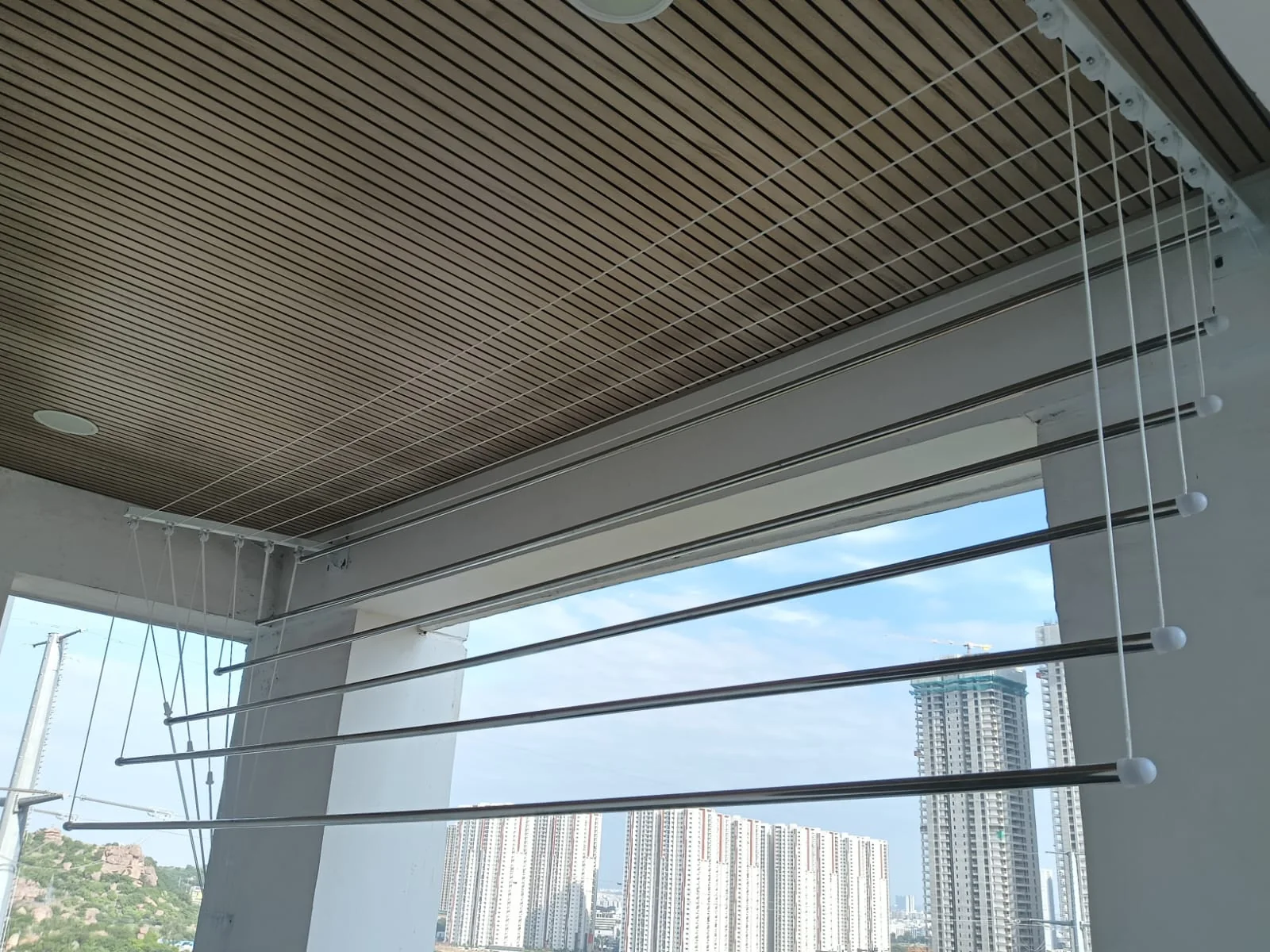 Ceiling-mounted cloth hanger installation — Marker Enterprises home safety installations in Chennai