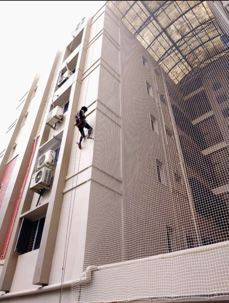 Protective netting installed across a building duct — Construction Safety Nets installation in Chennai